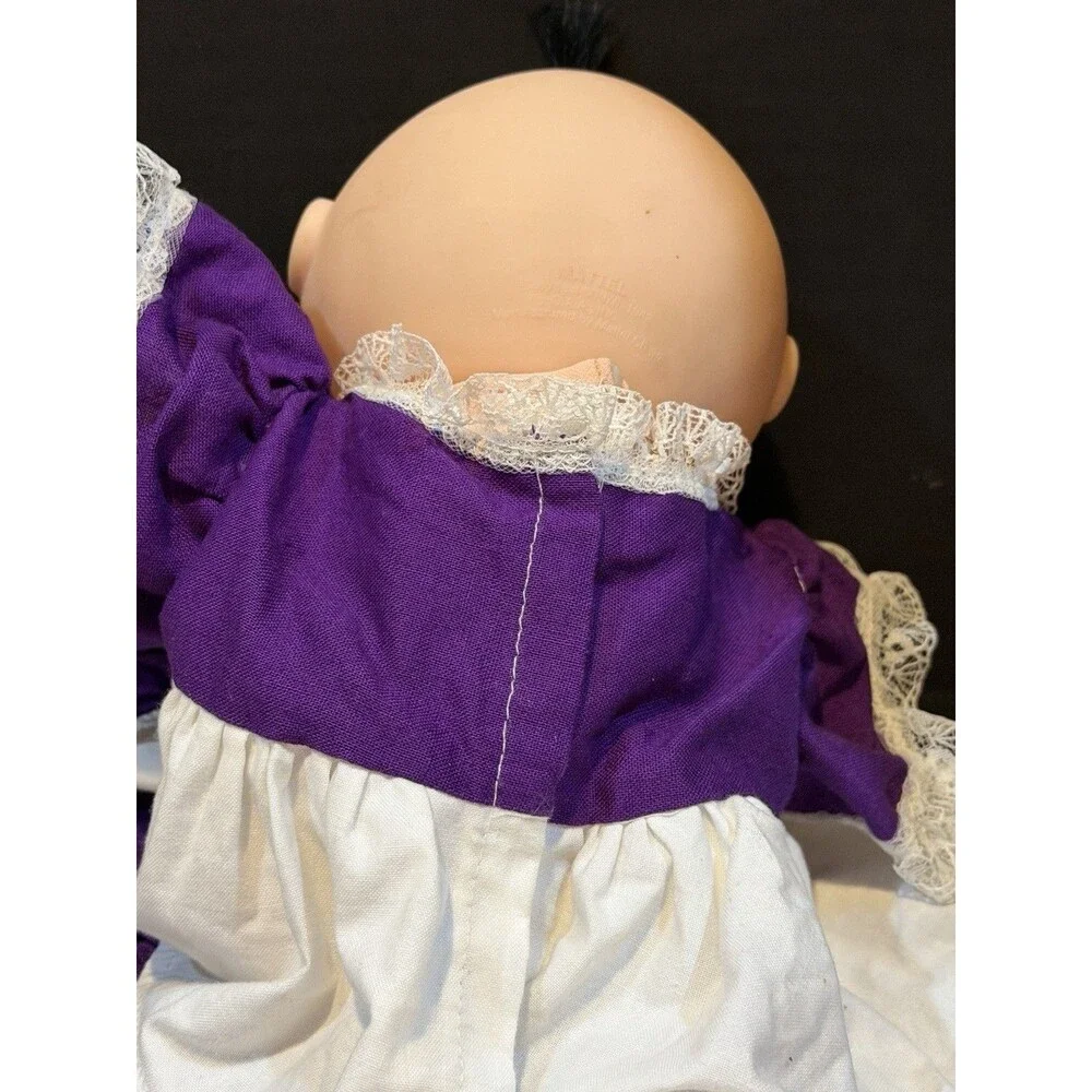 cabbage patch doll from 1990 made by mattel- purple dress